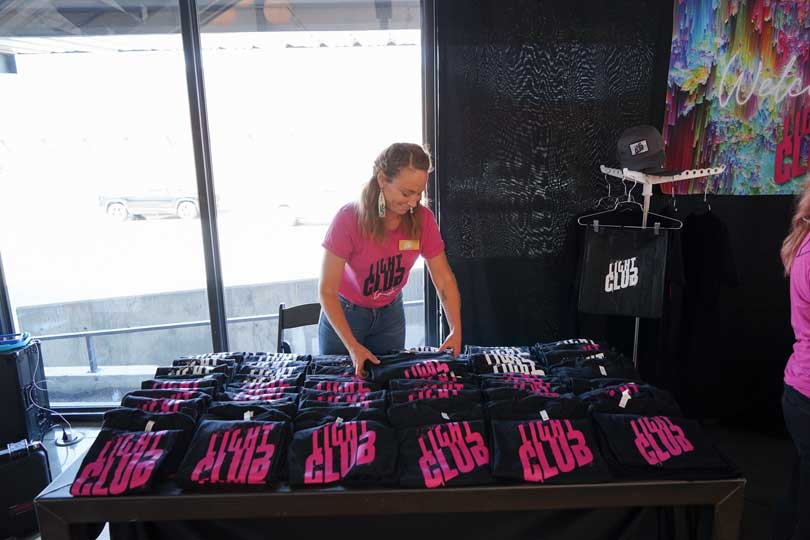 TLA team member arranges SWAG at April Light Club Event at Space Gallery hosted by The Lighting Agency