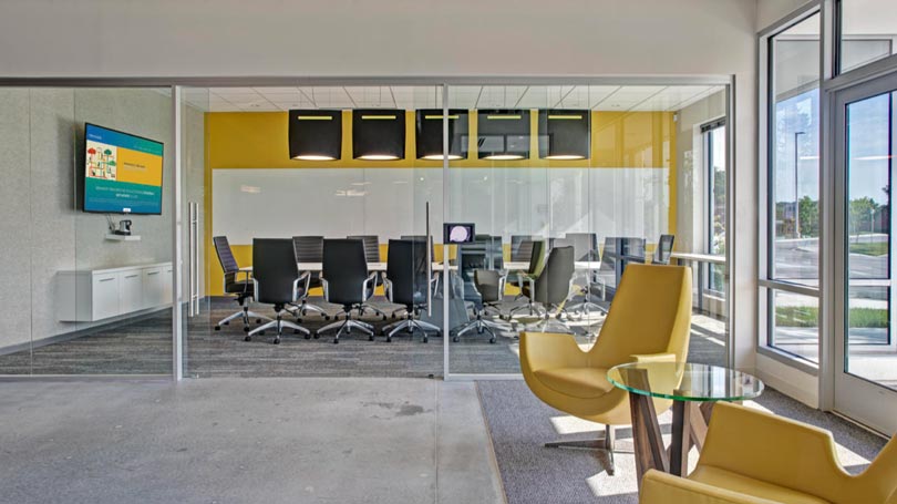BuzziBell in colorful office space by TLA new manufacturer BuzziSpace acoustic lighting